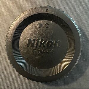 Genuine Nikon BF-1B - 18 F Mount - Camera Body Cap - Black.